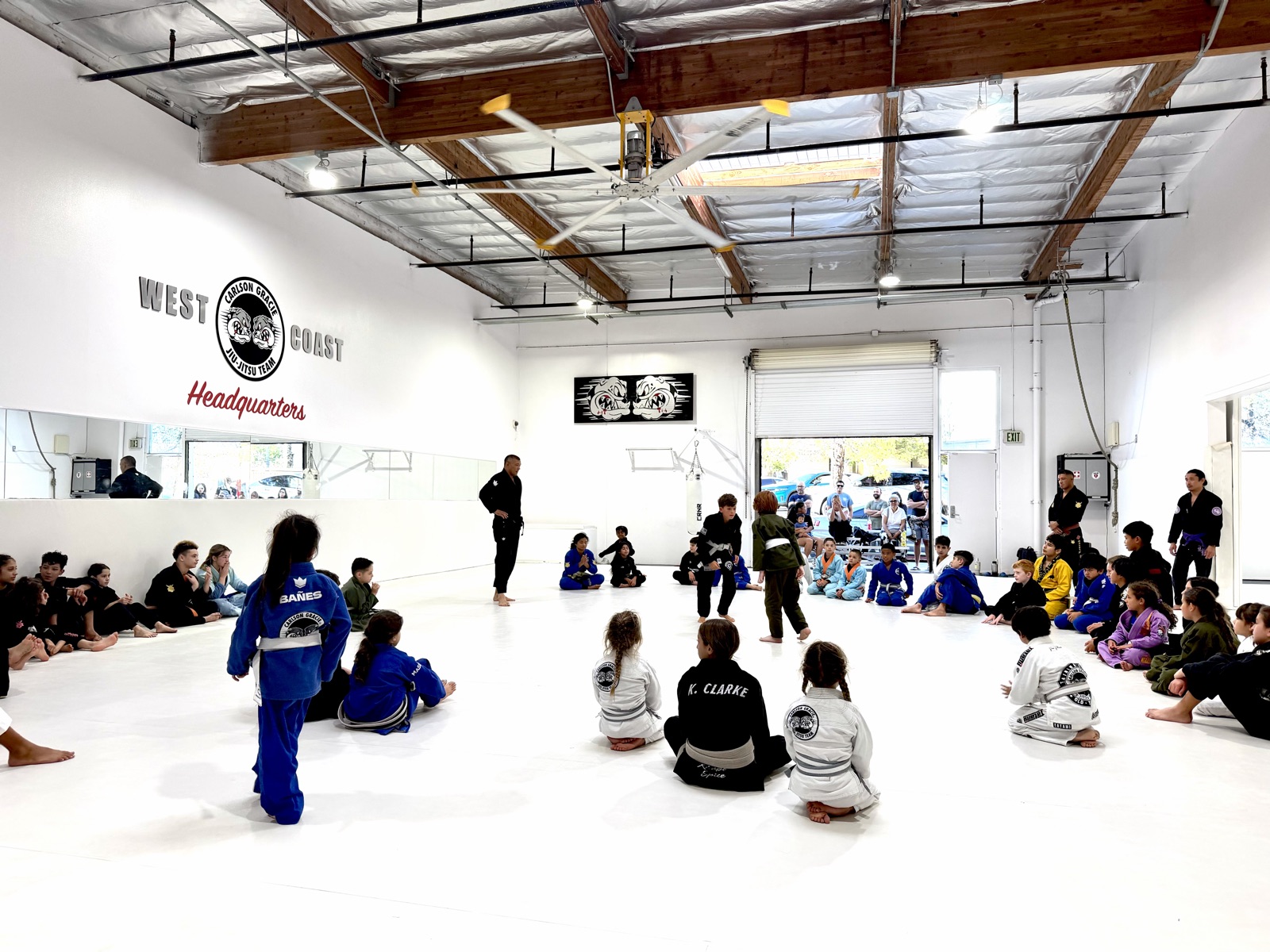 Kids seated around the mat at Carlson Gracie West Coast Headquarters in Temecula
